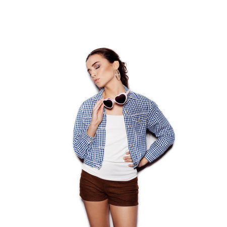 Girl in a sunglasses thinking on a white background not isolatedの写真素材