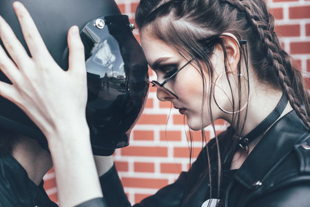 Couple in love. Bikers and vintage custom motorcycle. Outdoor lifestyle portraitの写真素材