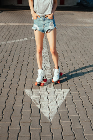 Teenage girl rollerskating in city