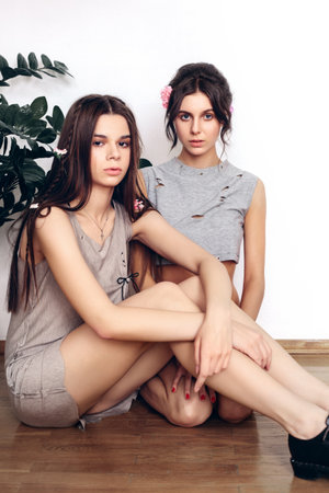 Beautiful female models posing in fashion clothesの写真素材