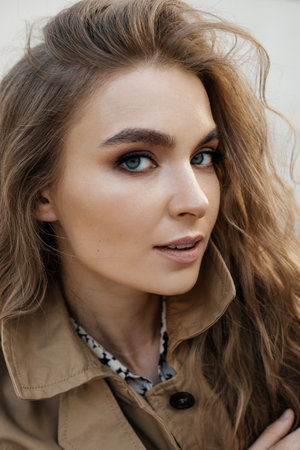 Beautiful blonde woman wearing coat . Street fashion.の写真素材