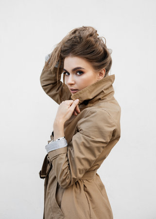 Beautiful blonde woman wearing coat . Street fashion.の写真素材