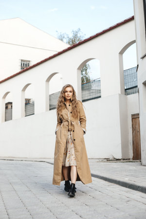 Beautiful blonde woman wearing coat . Street fashion.の写真素材