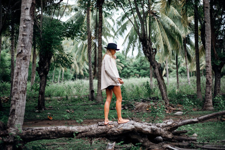 Beautiful girl in tropical forestの写真素材