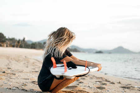 Surfer girl on beachの写真素材