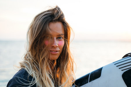 Surfer girl on beachの写真素材