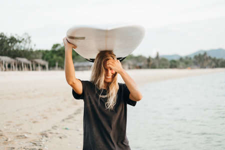 Surfer girl on beach