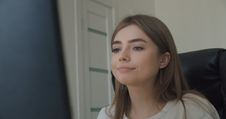 Business woman face looking at monitor in office. Close-up of girl thinking about mistakes in work....