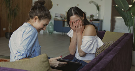 Two female friends with digital tablet computet