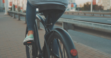 Young woman walking on city streets with bicycle , Urban biking, teenage girl and bike in town,...