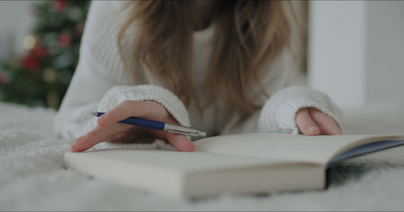 Girl makes notes in notebook