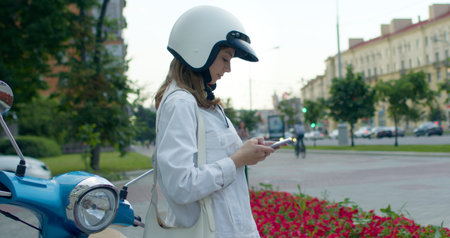 girl siting on bike and cheking phone