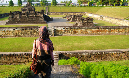 A tourist visiting Sambisari Temple in Yogyakarta, Indonesiaのeditorial素材