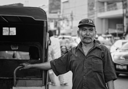 Bemo Driver Waiting for Passengers, Jakarta, Indonesiaのeditorial素材