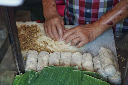 Lumpia /lunpia is a spring roll of Chinese origin commonly found in Indonesia. Originally made by Chinese immigrants, this lumpia is filled with bamboo shoots, dried shrimp, chicken, and/or prawns.の写真素材