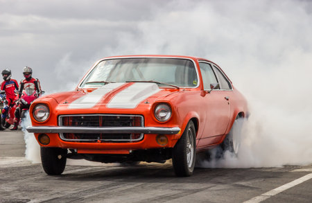 Iceland - June 29, 2013   Orange colored 1973 Chevrolet Vega at drag racing event のeditorial素材