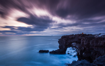 Dramatic sky over cliffs in Atlantic ocean, Reykjanes  Iceland.