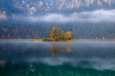 Reflections of the alps in a mountain lakeの写真素材