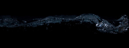 A wave on a black background