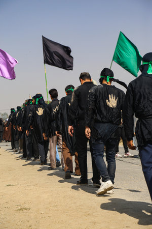 people attending the Ashura ritual.
Ashura is the mourning day of martyrdom of Hussein in 680 AD at Karbala. It is marked with mourning rituals and passion plays re-enacting the martyrdom.のeditorial素材