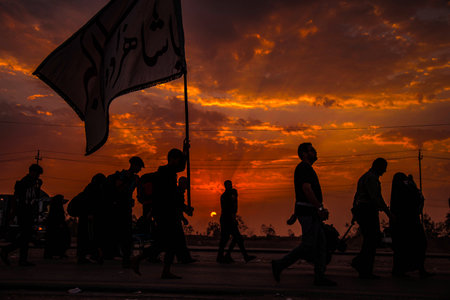 silhouette of pilgrims at sunset, iraq