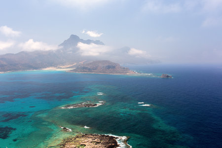 blue lagoon and the mountains in the cloudsの写真素材