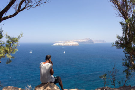 Pensive man looking at seaの写真素材