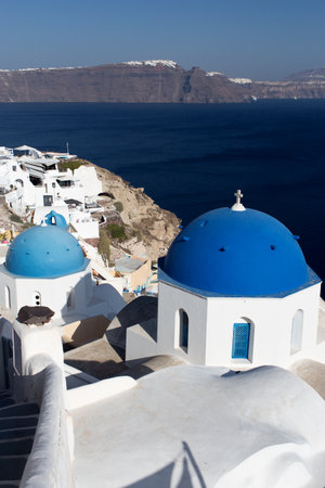 Santorini Island - view of the white city and the blue seaの写真素材