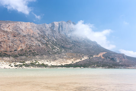 Blue lagoon and the mountains in the cloudsの写真素材