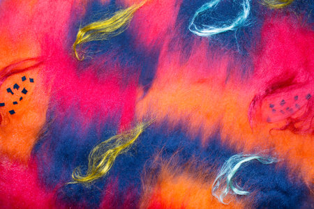 Background of multicolored wool with water dropletsの写真素材