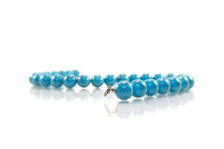 Turquoise necklace on white background. Isolated. Close-upの写真素材