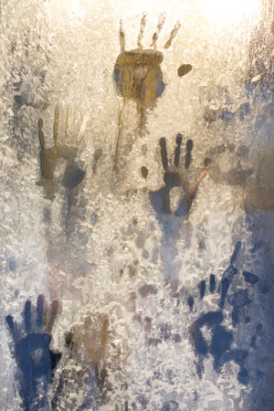 handprint on the frozen ice window. Close upの写真素材
