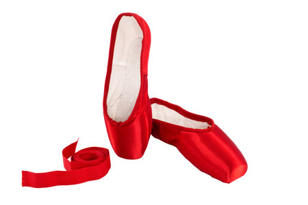Red ballet pointe shoes on white backgroundの写真素材