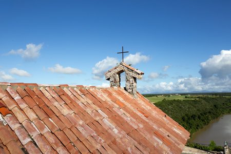 The roof of the Catholic church against the sky.の写真素材
