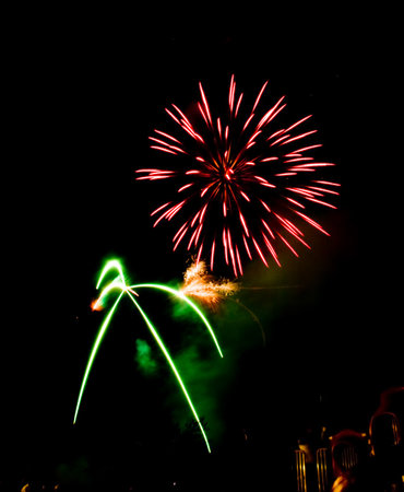 Many golden fireworks bursts at fireworks festival.