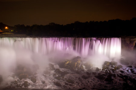 Niagara Falls at night in rainbow colors (The Horseshoe falls)の写真素材