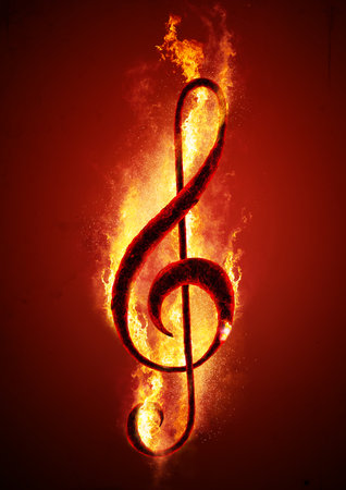 Musical note (treble clef) from hot charcoal on fire. Conceptual image of hot music.の写真素材