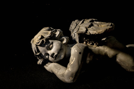 Statue of an Angel fast asleep.