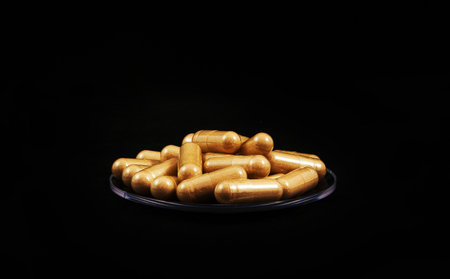 Heap of pills isolated on Black backgroundの写真素材