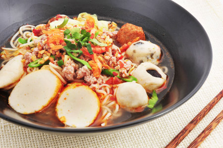 Hot and Spicy noodle soup with fish ball の写真素材