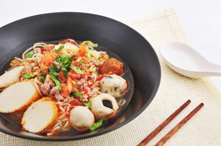 Hot and Spicy noodle soup with fish ball の写真素材
