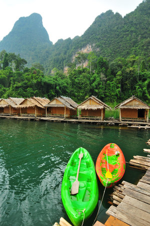 Kayak and hut in the lake,thailandの写真素材