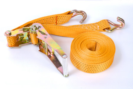 Yellow towing rope with metal hooks for car transportation isolatedの写真素材