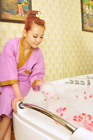 Woman relaxing at water spaの写真素材