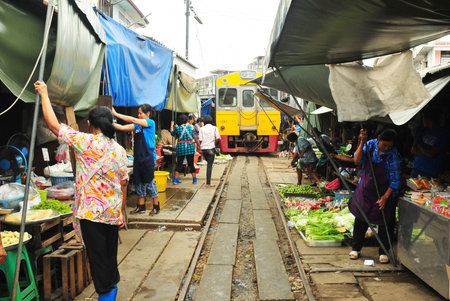 MAEKLONG, THAILAND-AUG 20  The famous railway markets at Maeklong, Thailand, August 20 th, 2012, Bangkok, Thailand Three times a day the train runs through these stalls  のeditorial素材