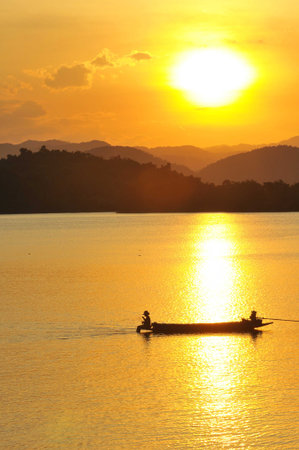 sunset on the lake, boat の写真素材