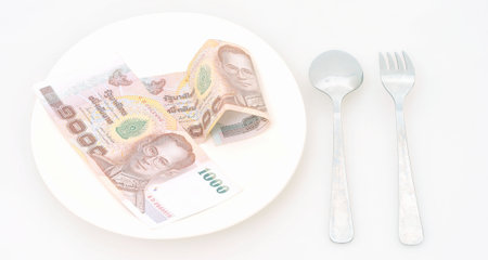 High price of food concept  Eating money for dinnerの写真素材