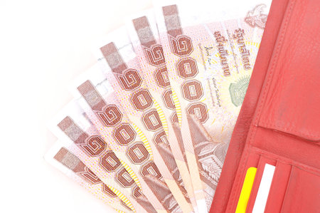 Leather wallet with banknotes on white background の写真素材