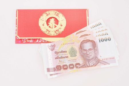 thai money in red envelope on white background  Chinese New Year  の写真素材