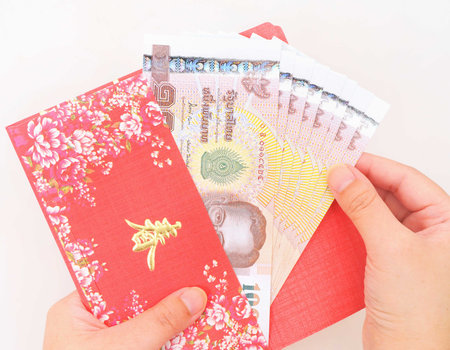 thai money in red envelope on white background  Chinese New Year  の写真素材